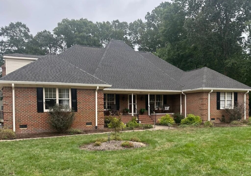 Alpine Exteriors performing detailed superior roof replacement on suburban homes.