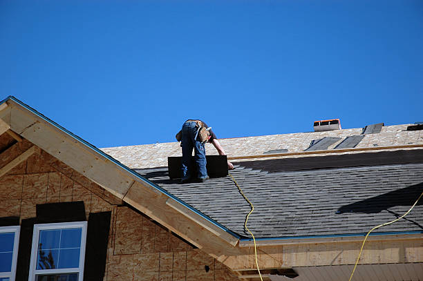 Roof technician repairing roof in Milwaukee, OR