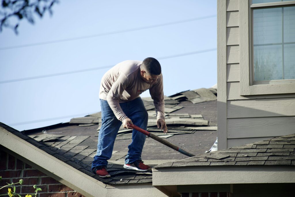 Alpine Exteriors performing roof repair services in Fairview home