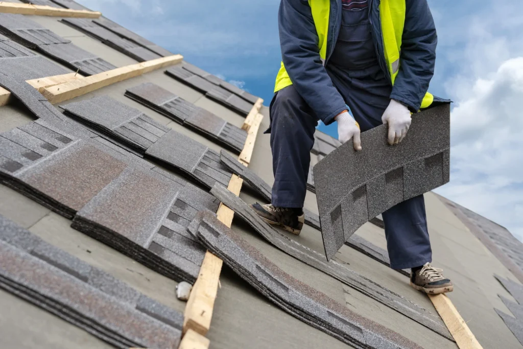Professional roofer replacing shingles in Estacada, OR home