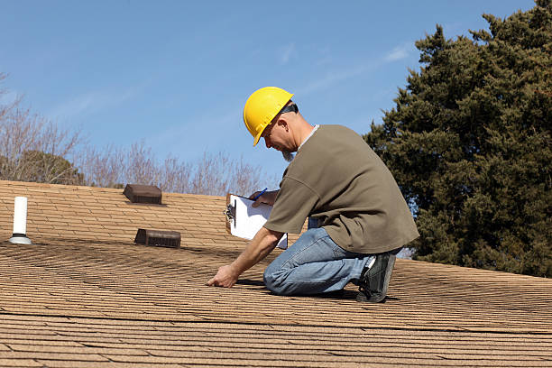 Alpine Exteriors technician performing thorough licensed roof inspection service